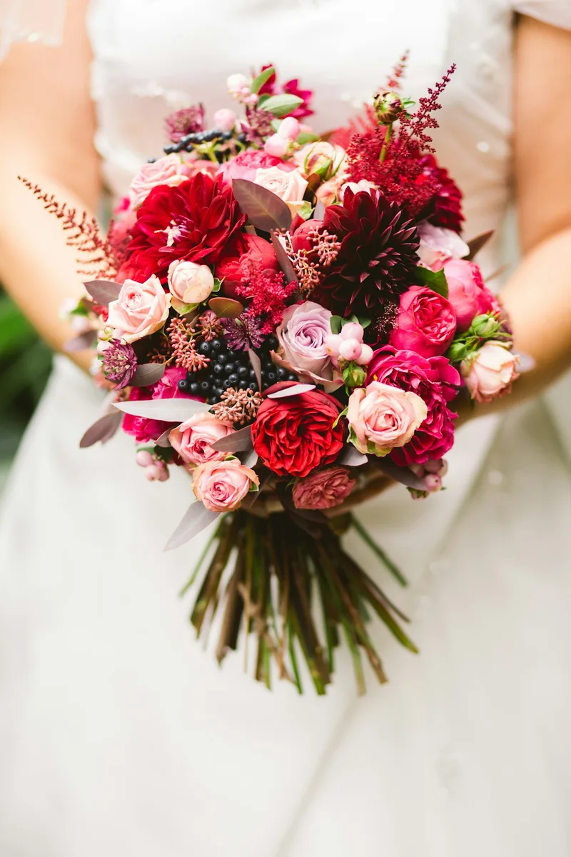 Wedding bouquet with burgundy and blush flowers